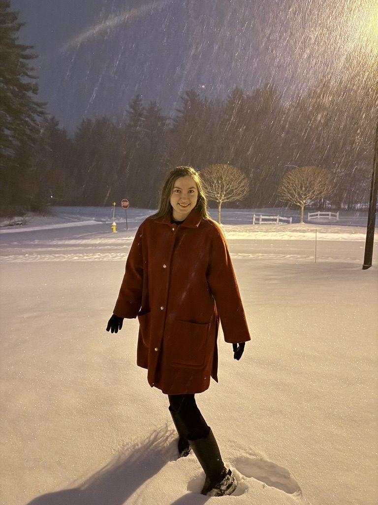 LeAnne Weber in a red coat in the snow